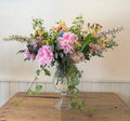 Copa  con flores de temporada